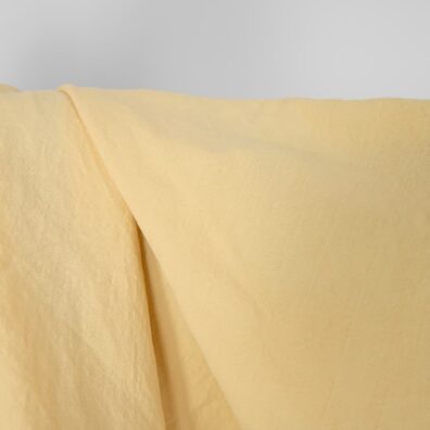Ľanovo-bavlnená látka žltkastá praná na odevy, textil